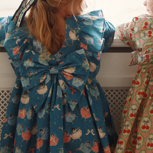 Evia Bow Ballerina Print Long Sleeve Ruffle Dress